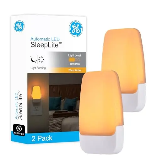 GE Sleeplite amber night light plugged into wall